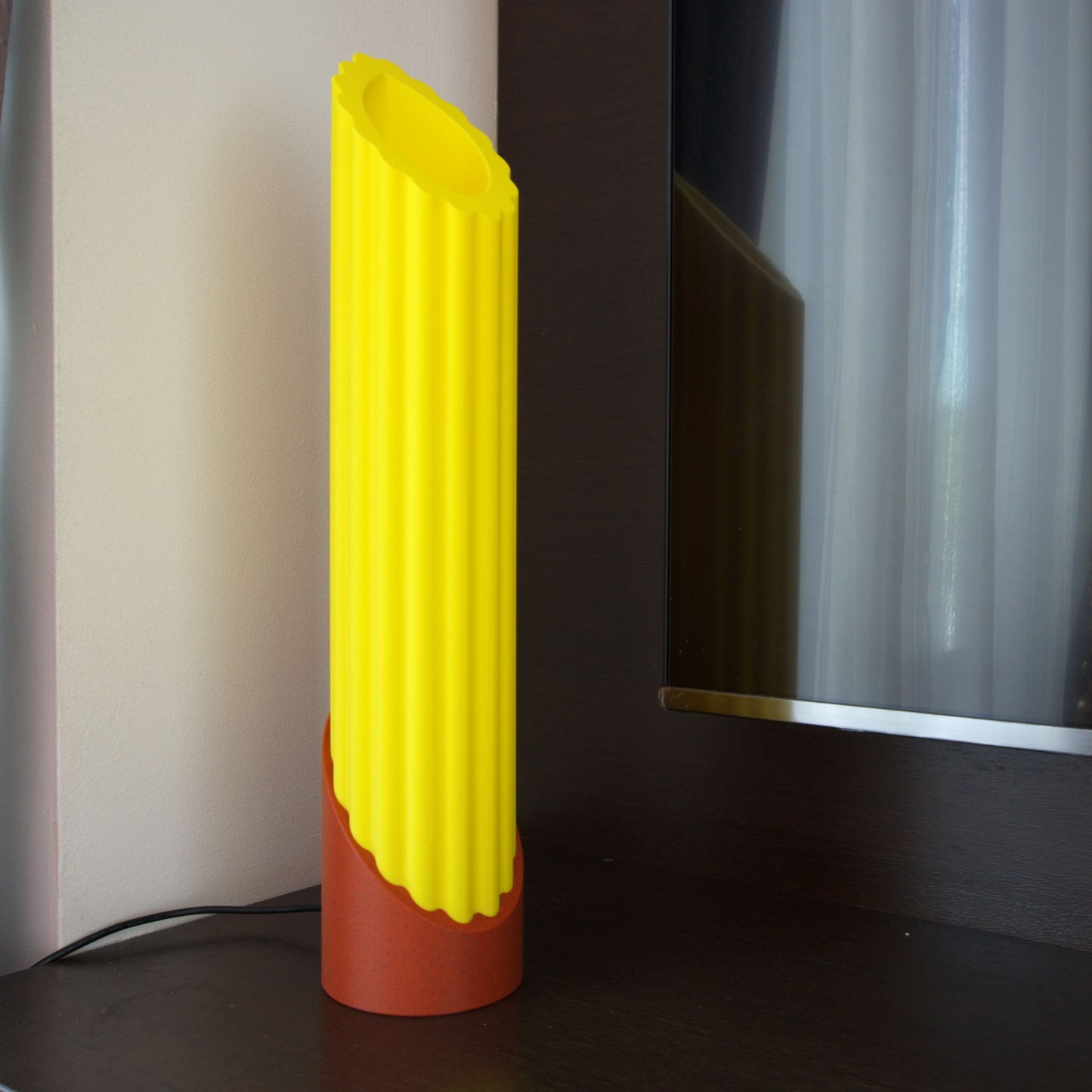 Unlit Penne Pasta lamp on the corner of a TV console, showcasing the pasta shape that remains beautiful even when not in use