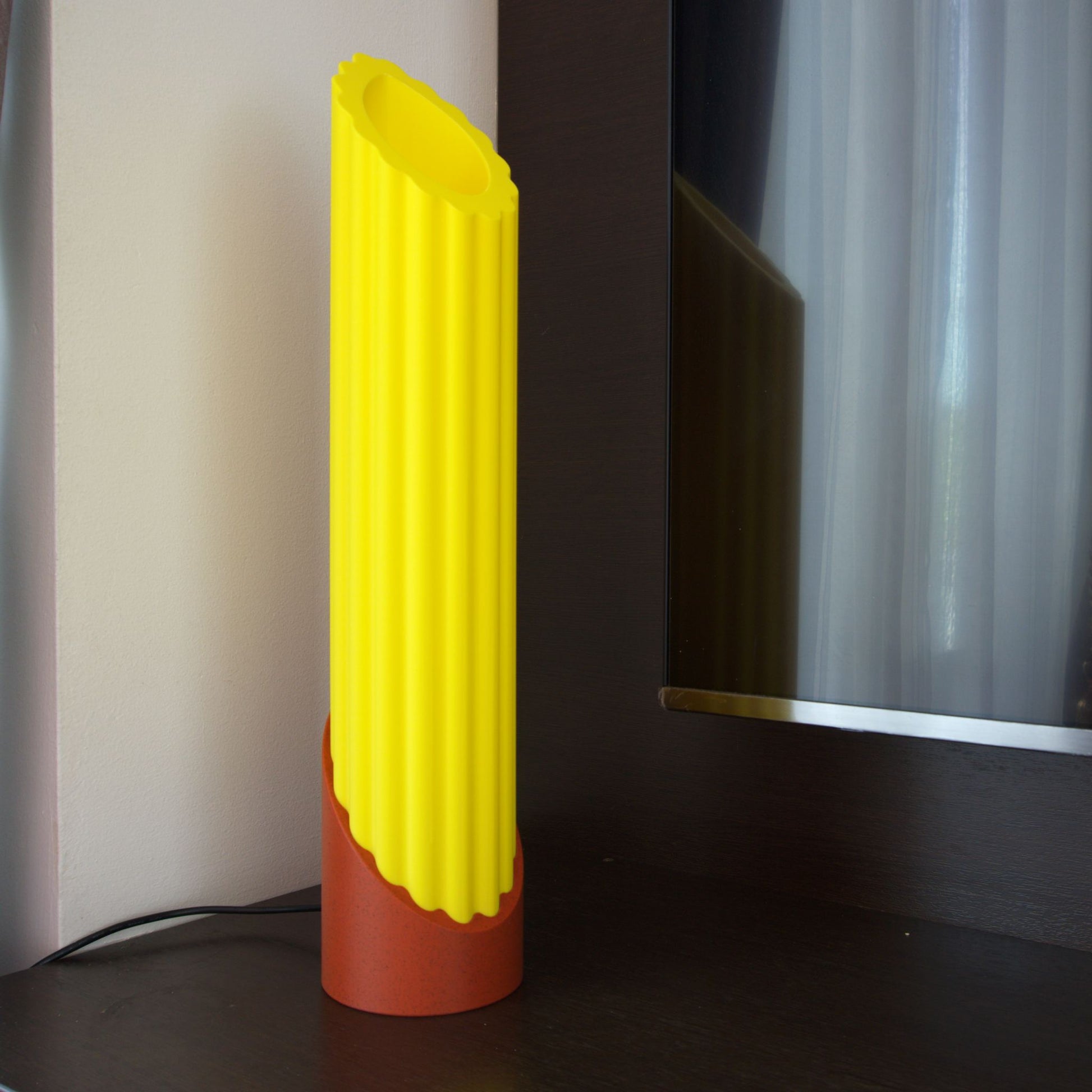 Unlit Penne Pasta lamp on the corner of a TV console, showcasing the pasta shape that remains beautiful even when not in use