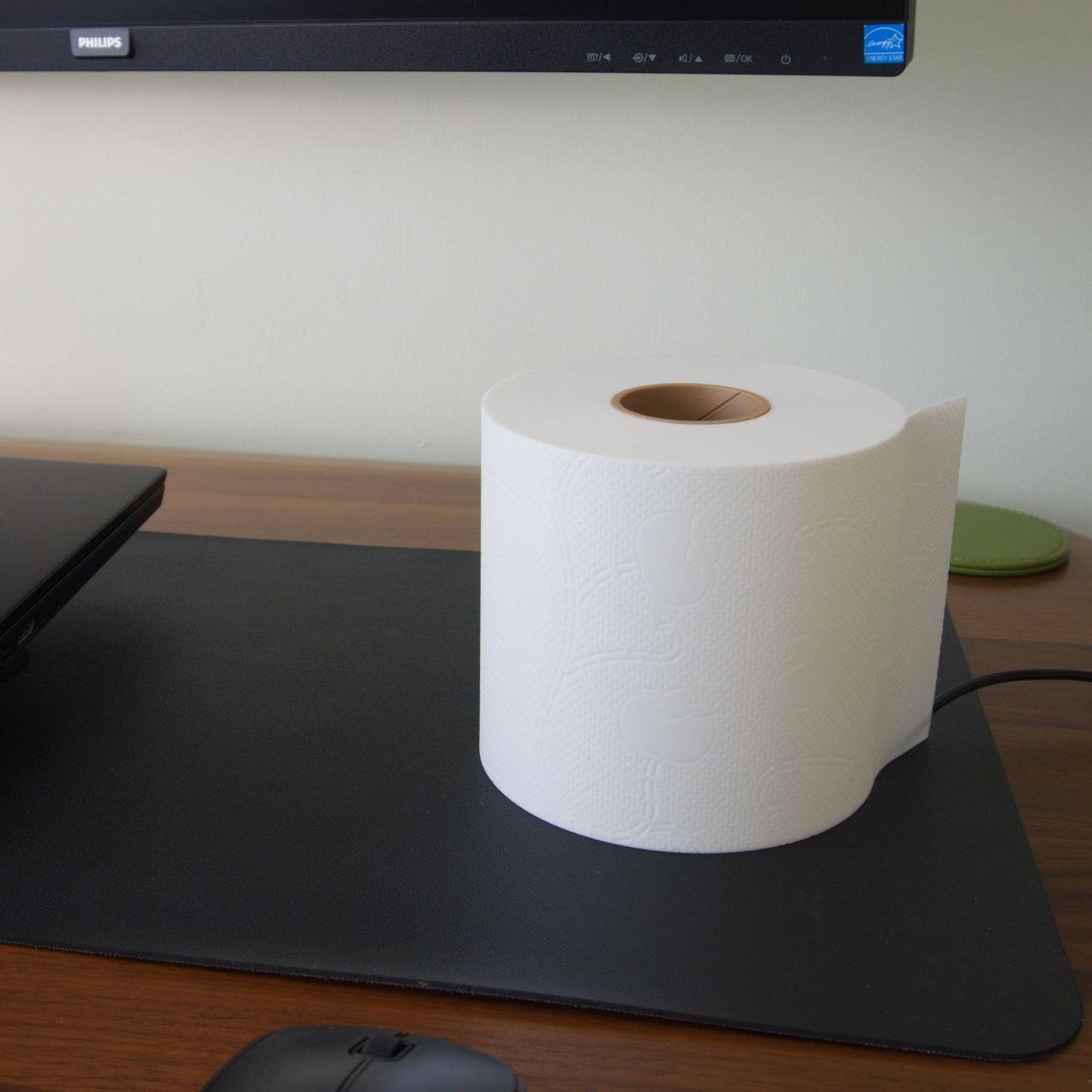 Unlit toilet paper lamp on a desk, showcasing a clean minimalist body that remains beautiful even when unlit
